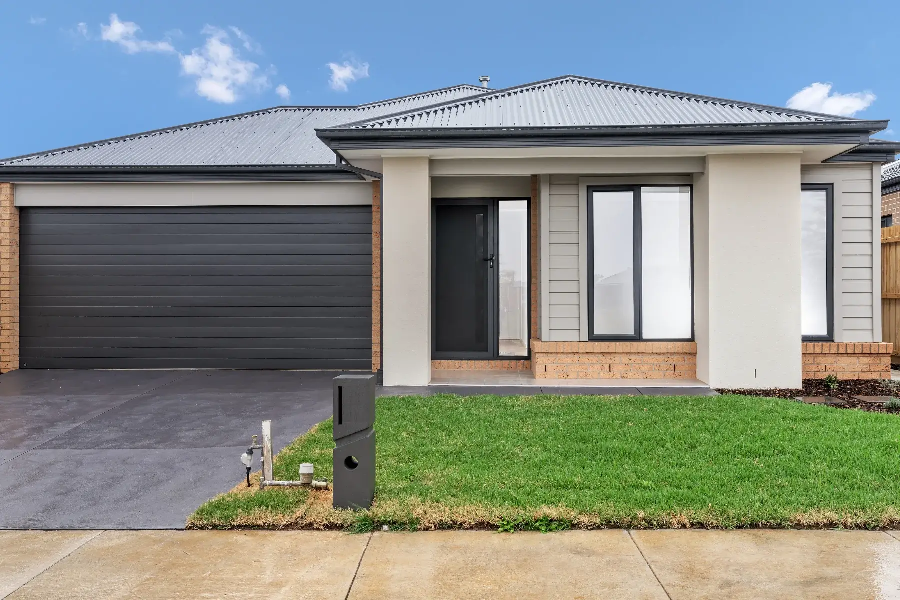 Front view of modern Sda Housing in Melton with accessible entrance and wide driveway