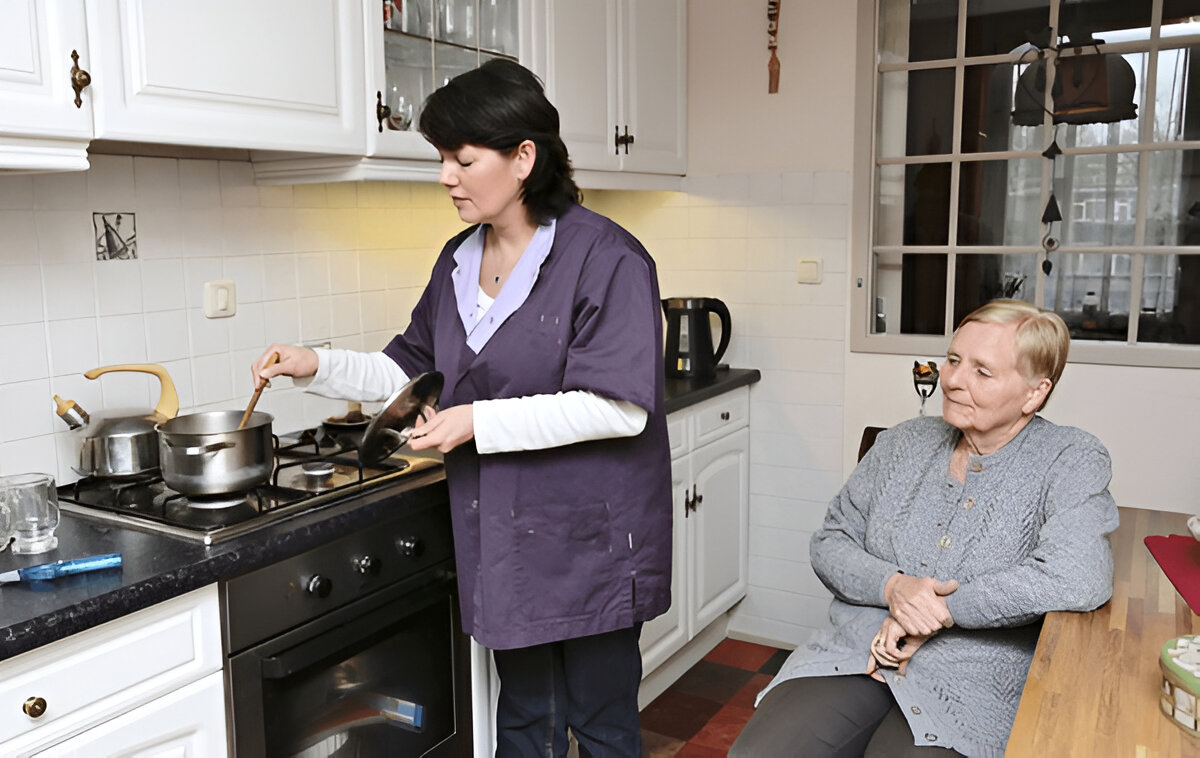 Support worker assisting with household cleaning as part of disability support services in Wyndham