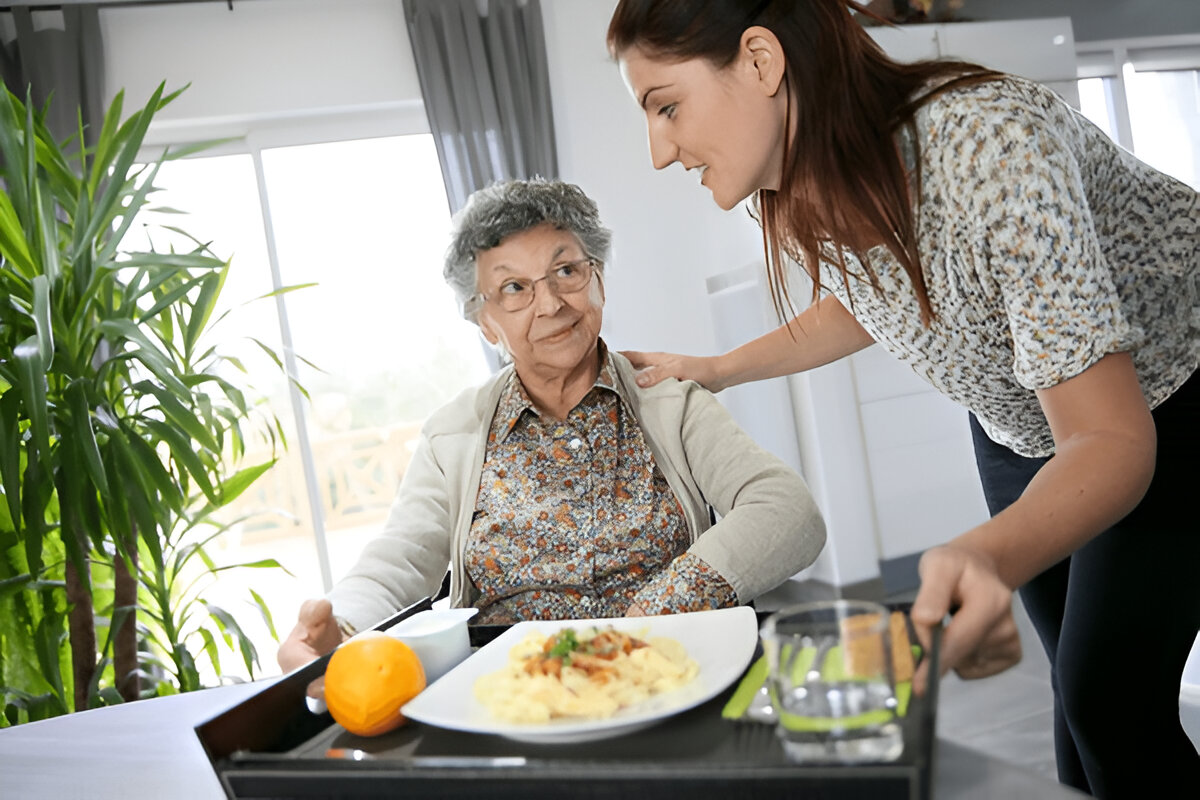 Disability support worker providing kitchen assistance in a safe home environment in Wyndham